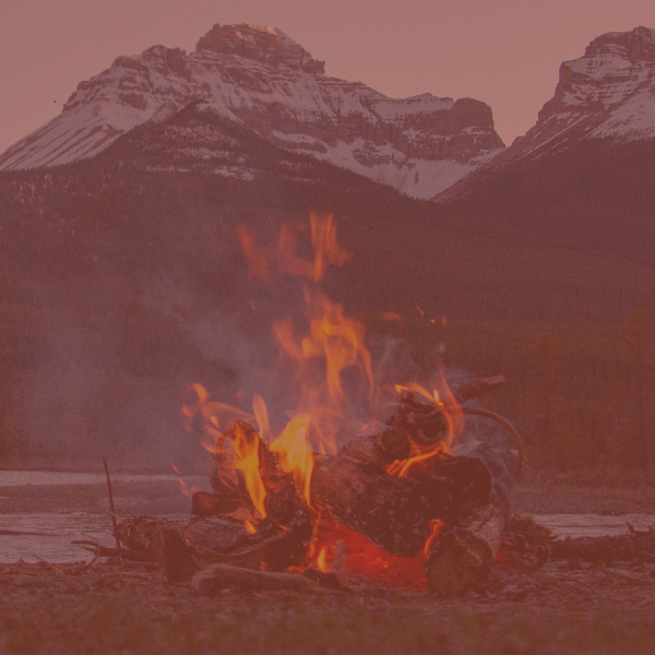 campfire next to a mountain