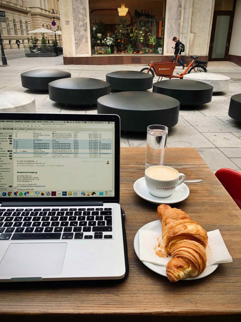 Woman at cafe on laptop