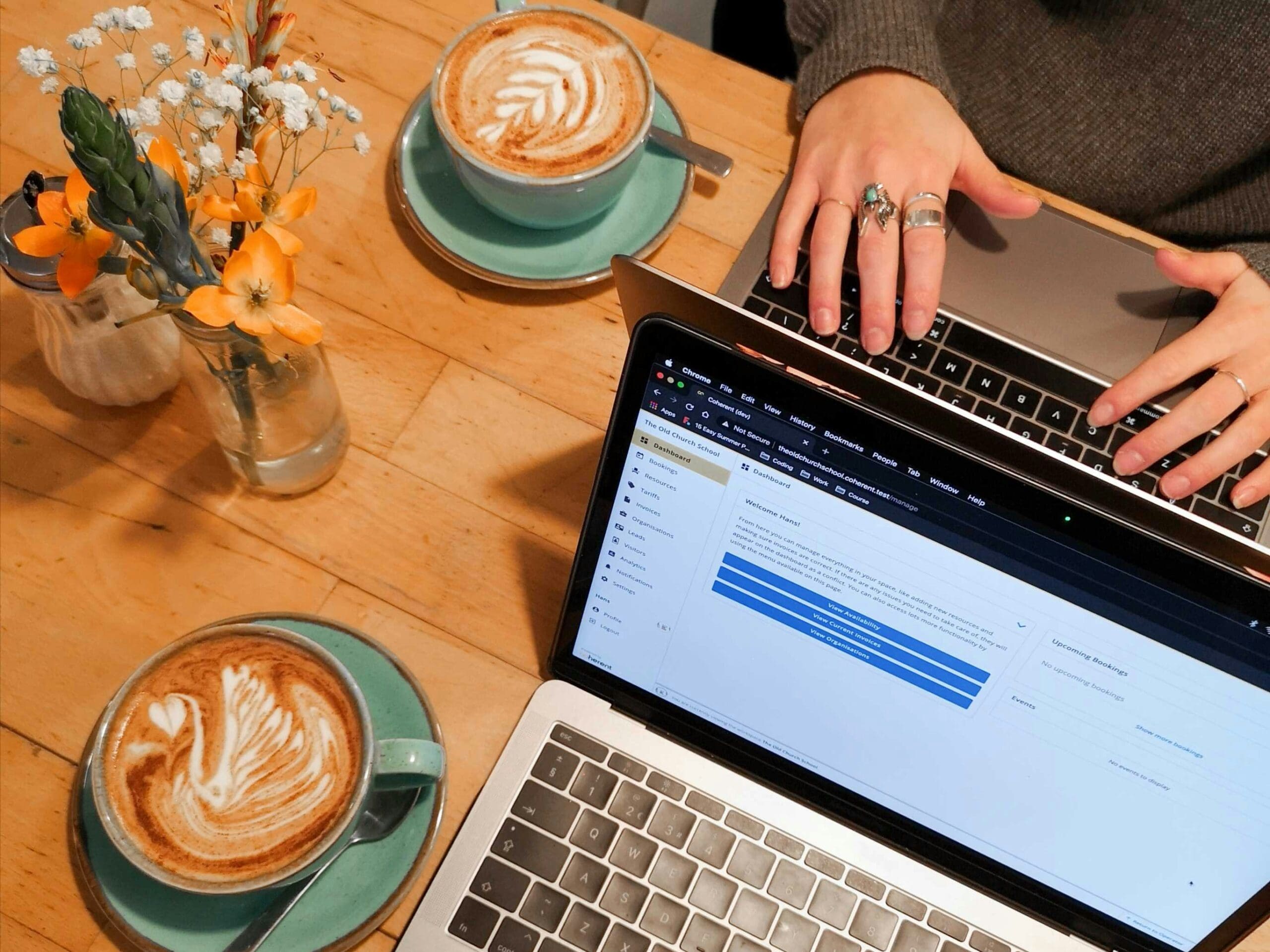 Creative working at their laptop with coffee.